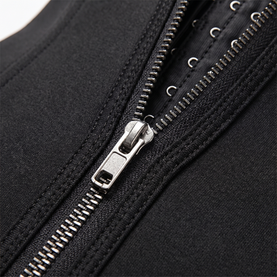 Closeup of zipper and hook-and-eye closure on corset