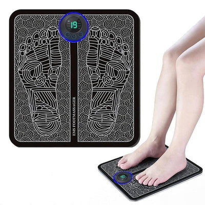 Bare feet standing on black EMS massage mat in use