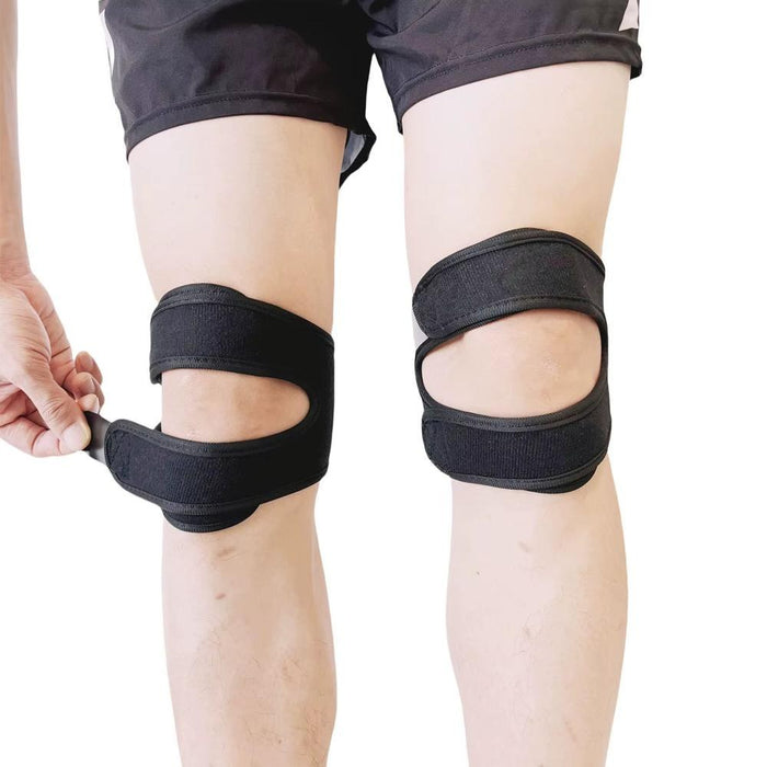 Adjustable knee strap brace worn on both knees, double velcro straps visible