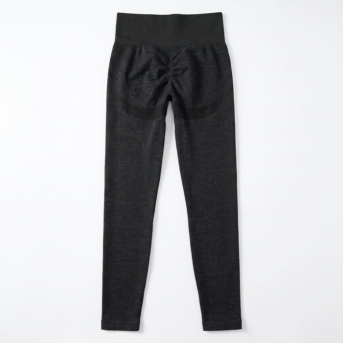 High-waisted black training leggings back view showing scrunch seam