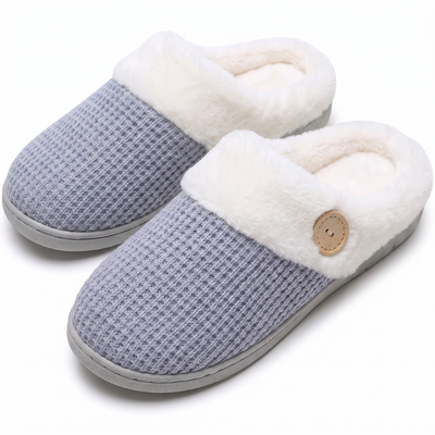 Light blue knit slippers with faux-fur collar on white background