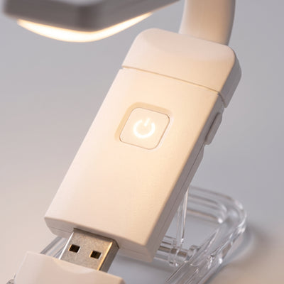 Closeup of power button glowing on book light