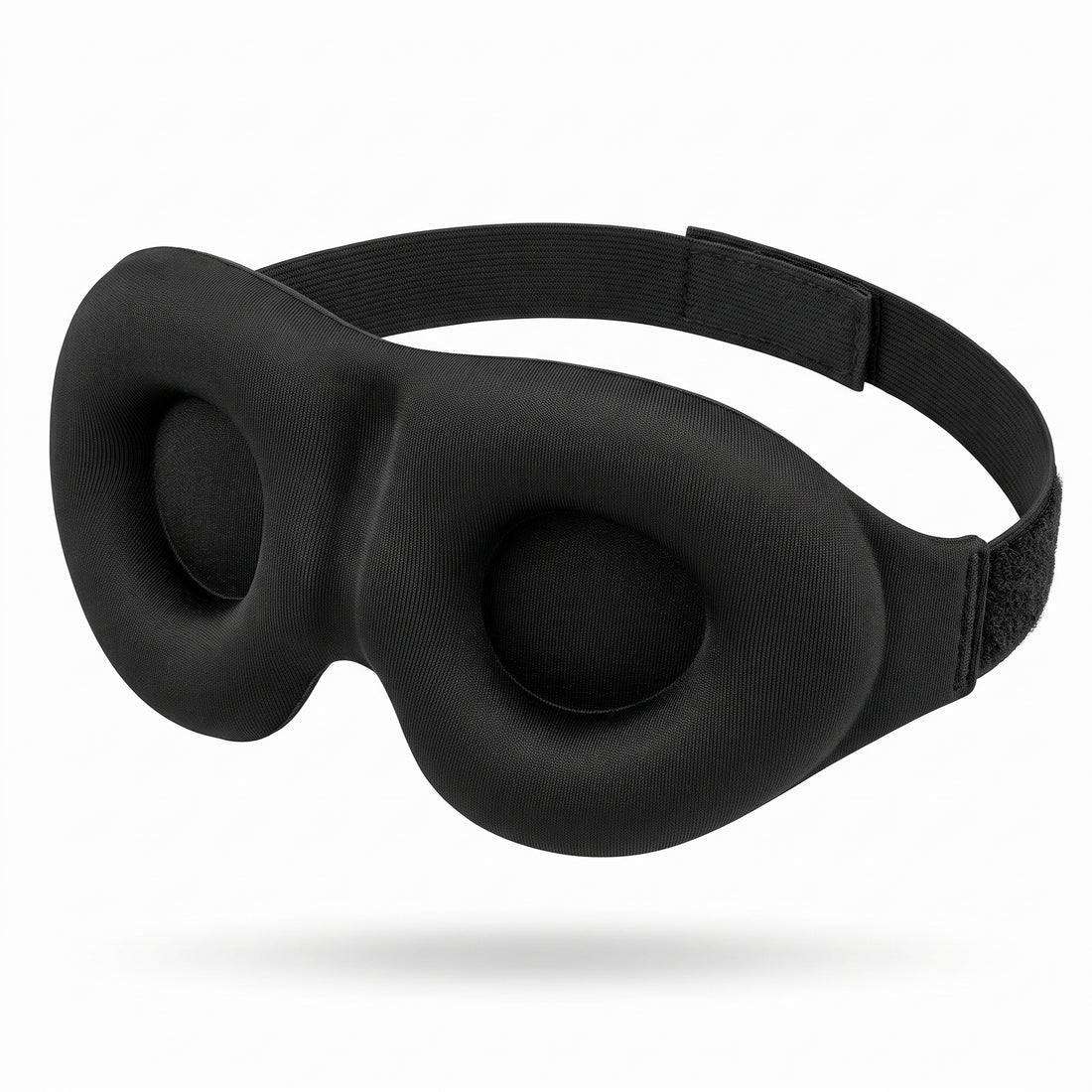 3D contoured black sleep mask on white background