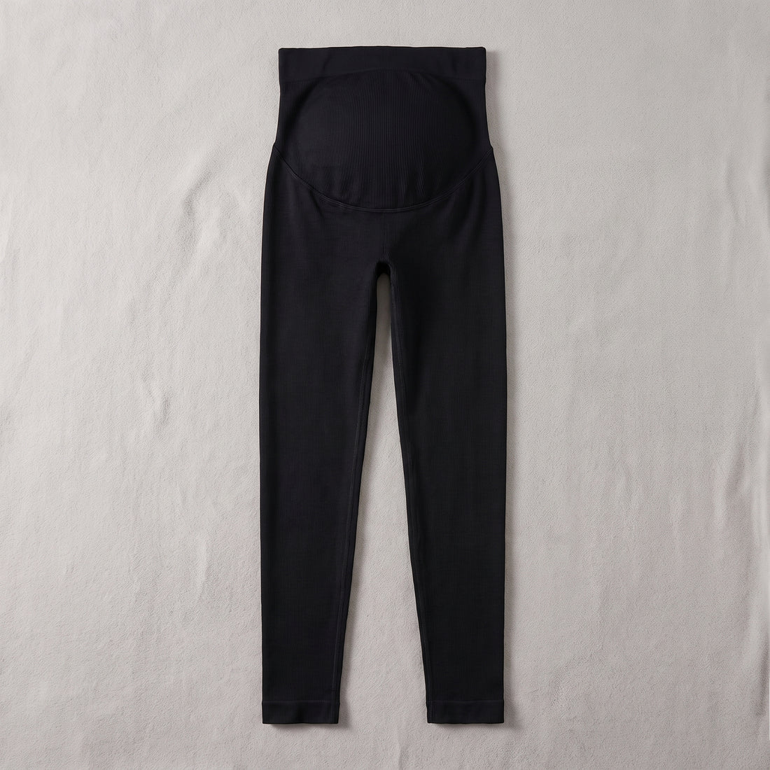 Black high-waist maternity leggings flat lay with belly panel