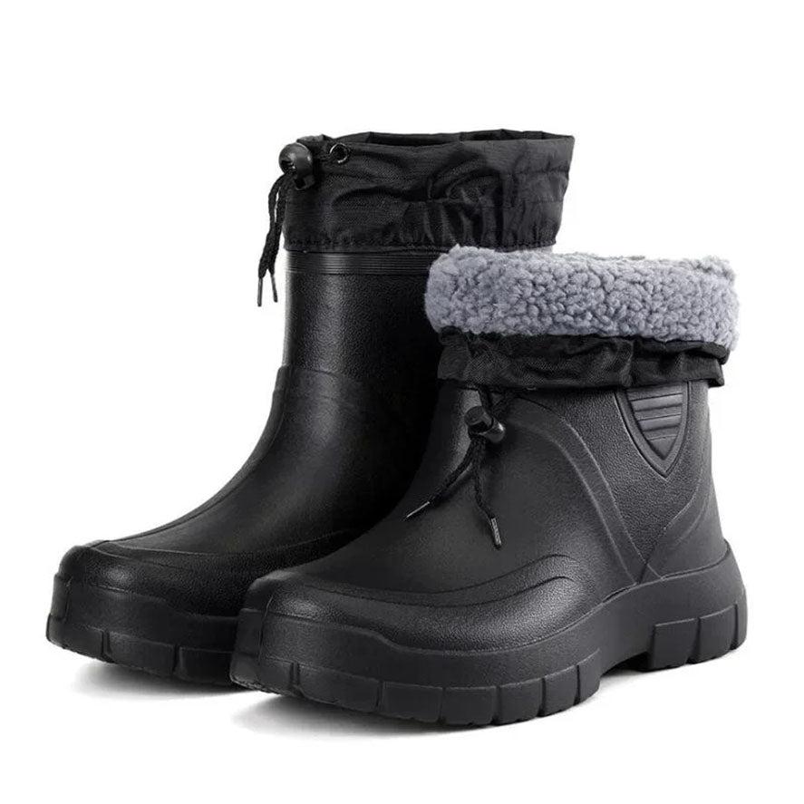 Black waterproof winter boot pair on white background