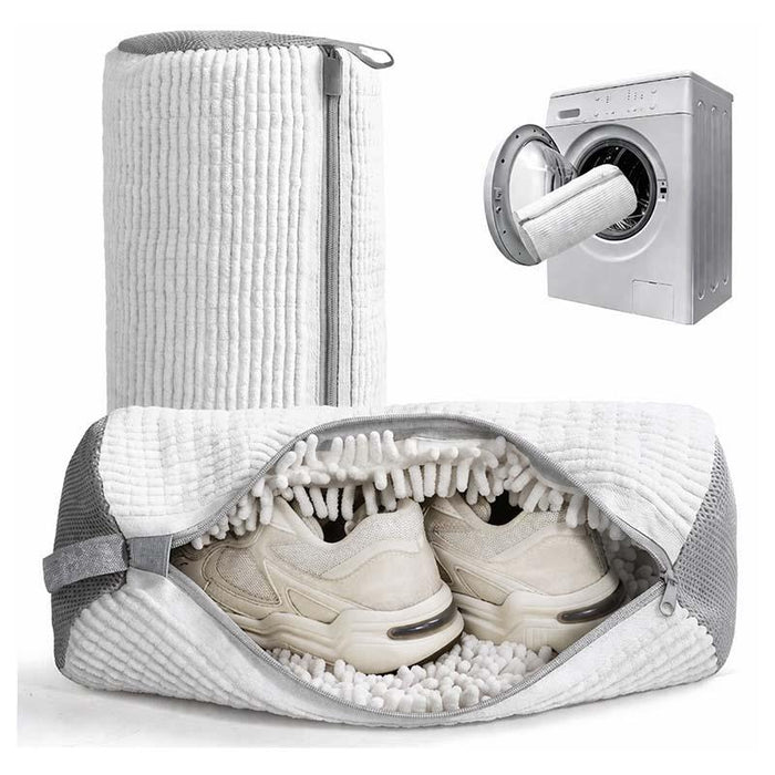 White shoe washing bag open with sneakers inside and washing machine