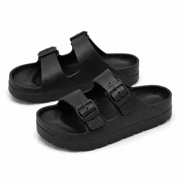 Black platform slide sandals pair on white background
