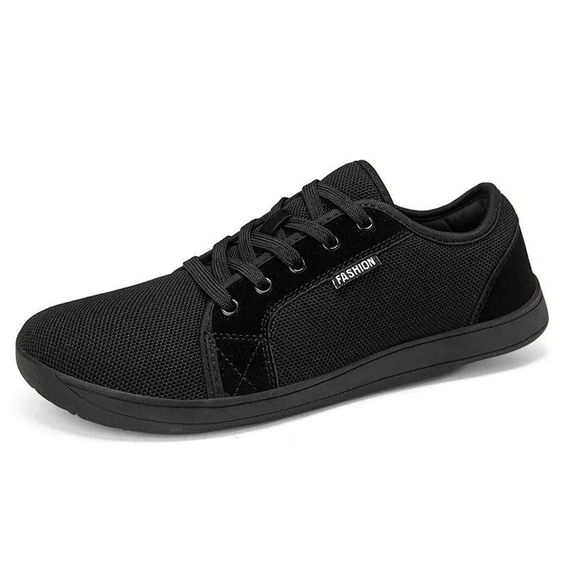 Black barefoot sneaker with wide toe box, hero angle