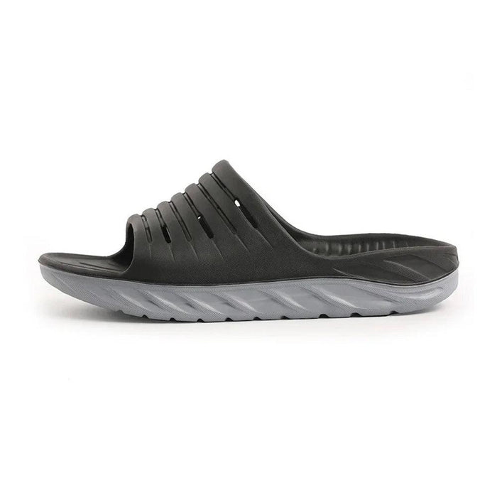 Black cushioned slide slipper side view