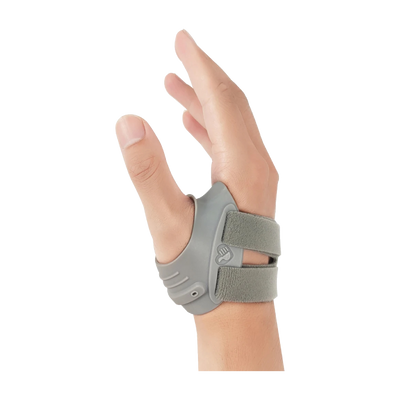 Gray thumb brace strapped around right hand