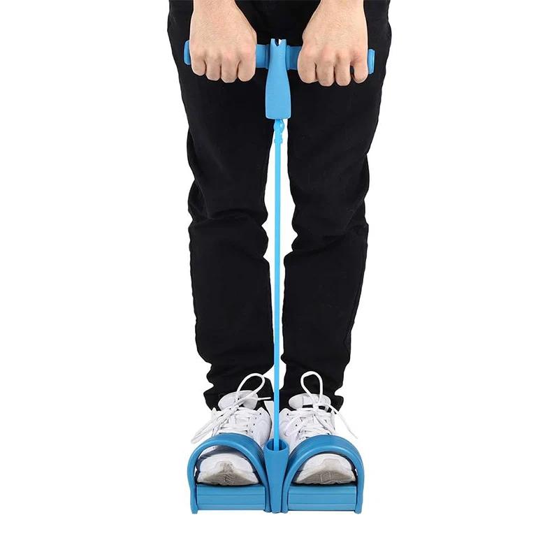 In-use shot: hands gripping handles, feet in pedals, blue band