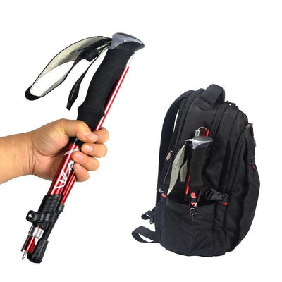 Folded walking pole held in hand and stored in a backpack
