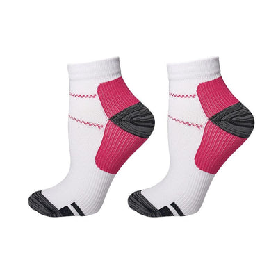 Pink compression ankle socks pair on white background