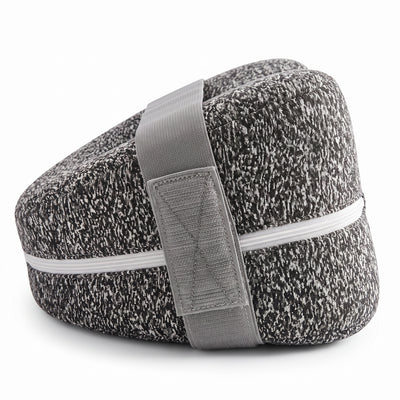 Knee pillow with elastic strap wrapped around it